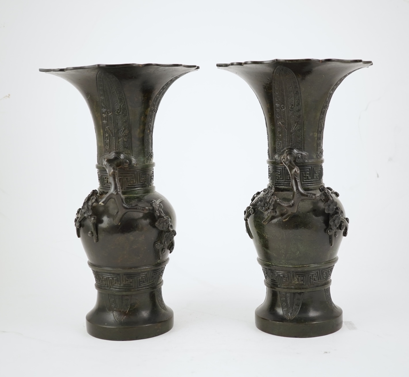 A pair of Chinese bronze gu-shaped vases, Qing dynasty
